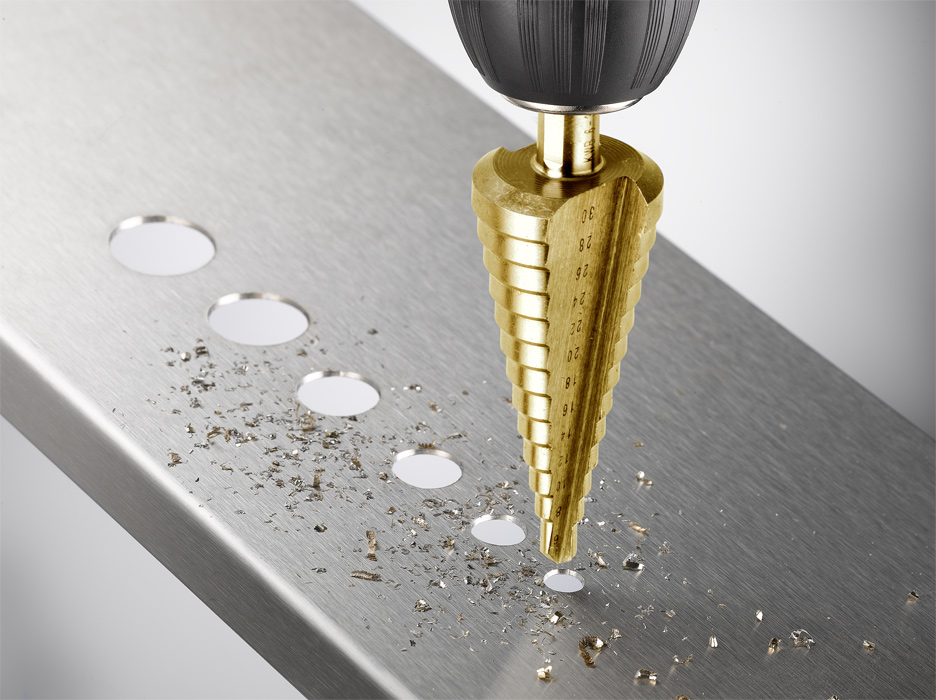 Large step drill shop bit